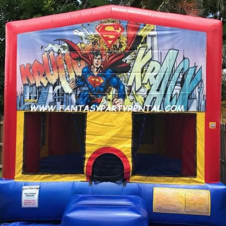 Superman primary colors standard size bounce house with basketball hoop.