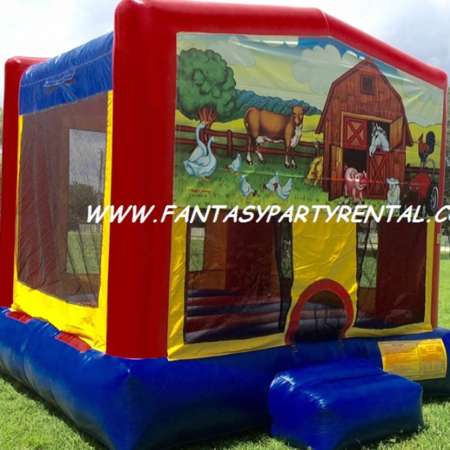 Animal Farm primary colors bounce house with basketball hoop.