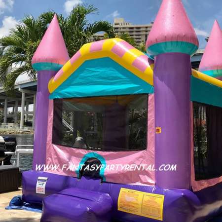 Dazzling castle standard size bounce house. Lavender, light pink, teal and yellow.