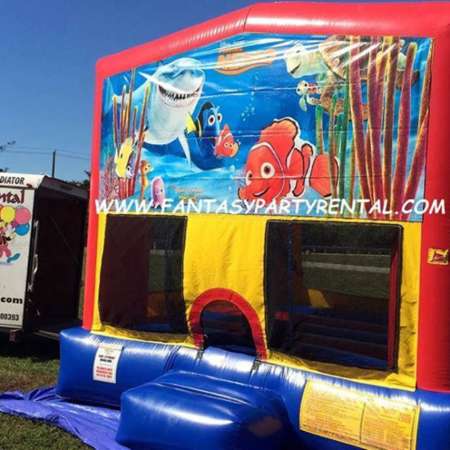 Finding Nemo primary colors bounce house with basketball hoop.