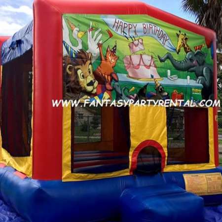 Happy Birthday primary colors bounce house with basketball hoop.