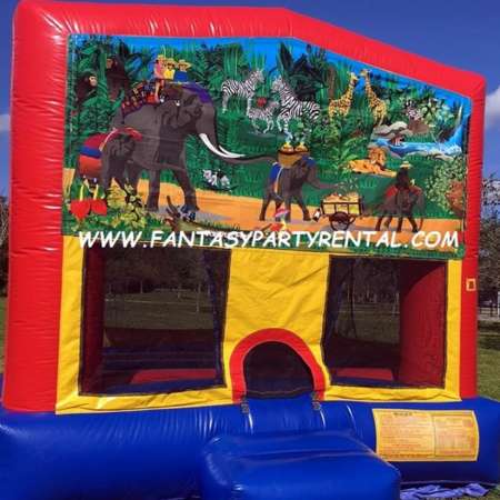 Jungle primary colors bounce house with basketball hoop.