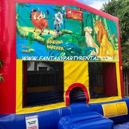 Lion King primary colors bounce house with basketball hoop.