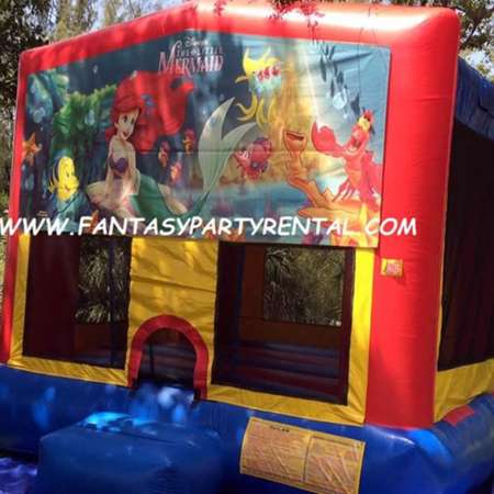 Little Mermaid primary colors bounce house with basketball hoop.