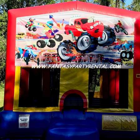 Monster Truck primary colors bounce house with basketball hoop.