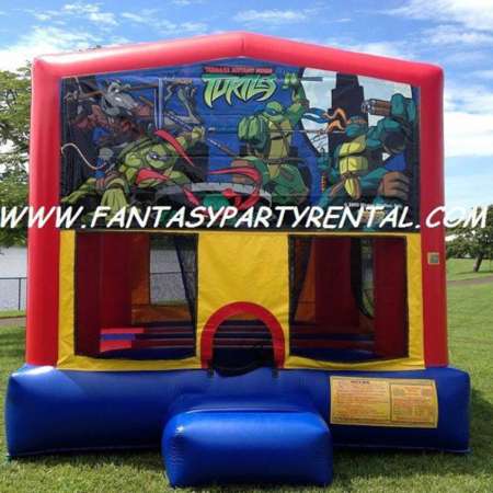Ninja Turtle primary colors bounce house with basketball hoop.