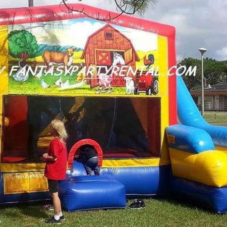 Animal Farm Combo 7 in 1 bounce house. Bounce, pop up and side obstacles, 2 basketball hoops, climb, dry slide.