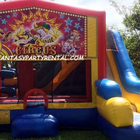 Circus Combo 7 in 1 bounce house. Bounce, pop up and side obstacles, 2 basketball hoops, climb, dry slide.