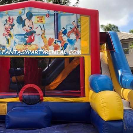 Mickey Mouse Combo 7 in 1 bounce house. Bounce, pop up and side obstacles, 2 basketball hoops, climb, dry slide.